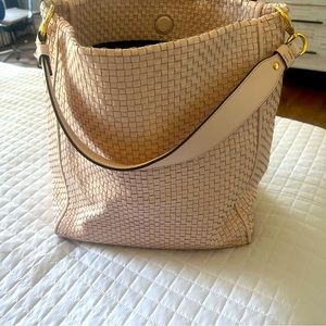 Pale pink basket weave large shoulder. Light for light wear on bottom feet.